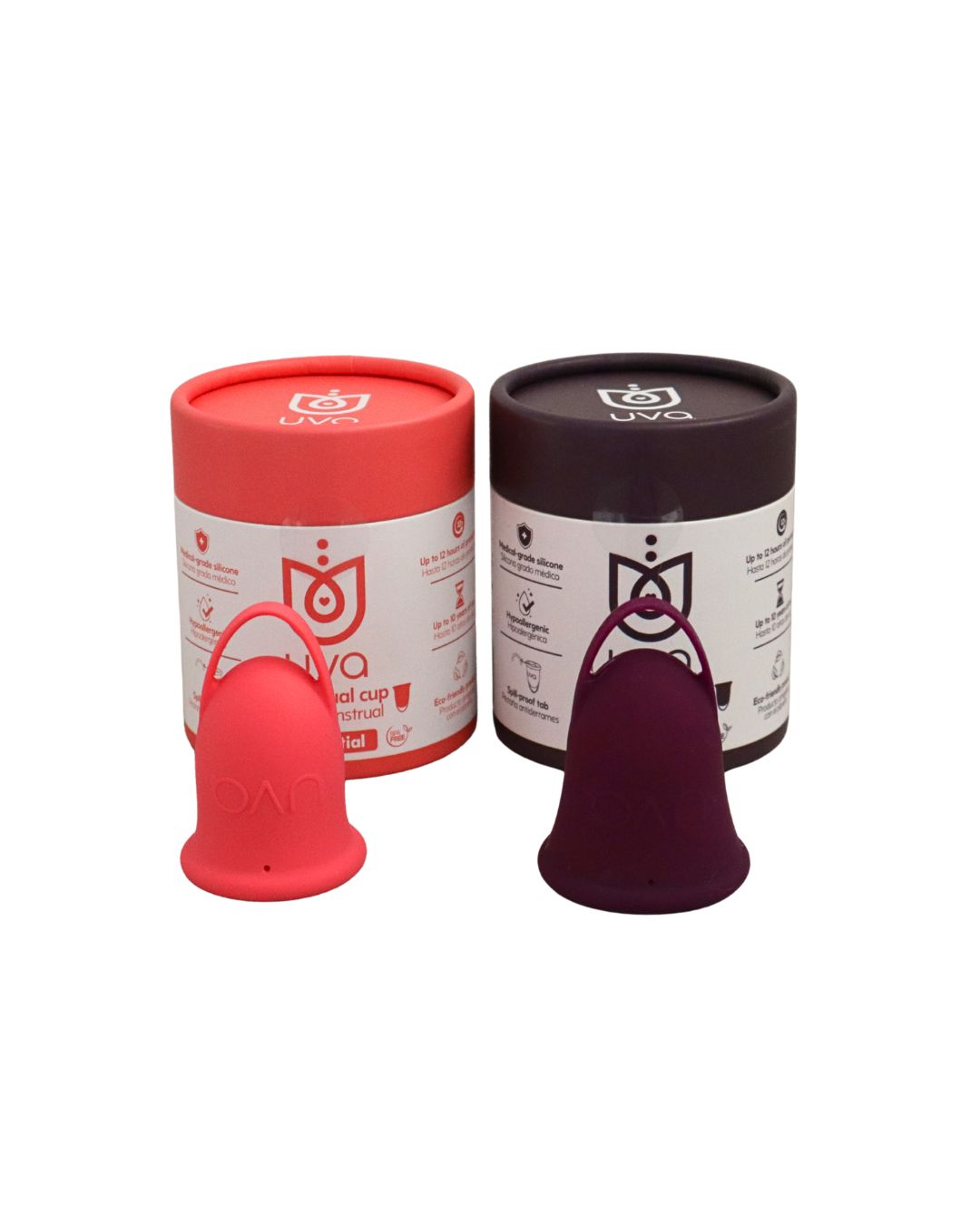 Las dos copas menstruales, salmón y uva, de pie junto a su empaque