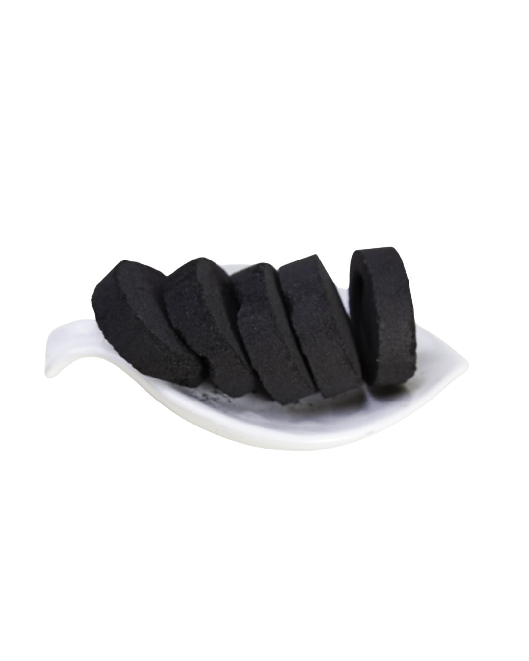 Pastillas de carbón para incienso apiladas, vista lateral