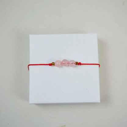 Pulsera de Cuarzo Rosa Hilo rojo 